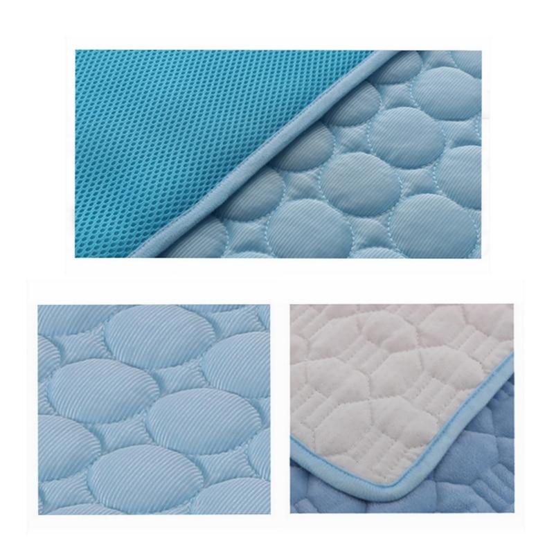 Blue quilted pad with textured surface and corner detail on a white background