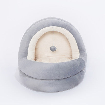 Gray and white pet bed on a light gray background