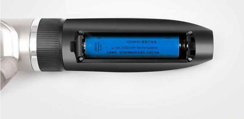Close-up of a cylindrical electronic device with a blue battery label on a white background