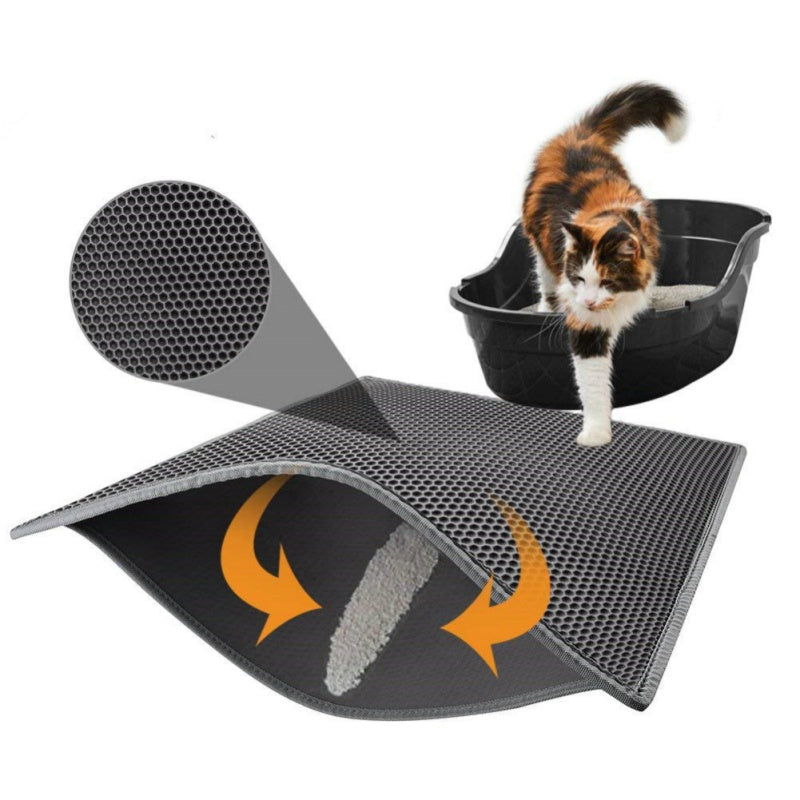 Cat litter mat with textured surface and cat standing on it, on a white background