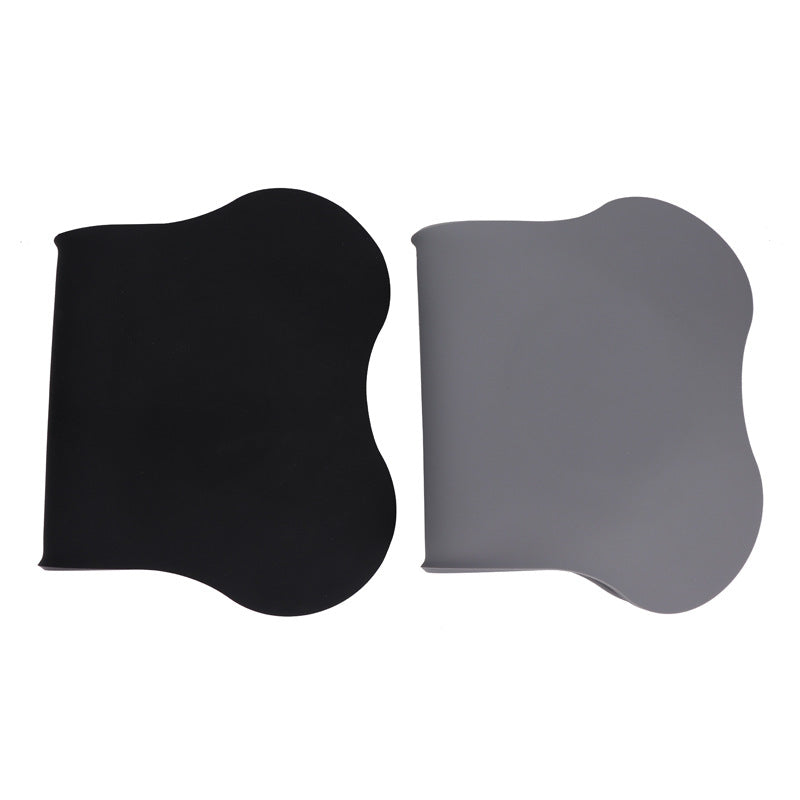 Black and gray curved pads on a white background