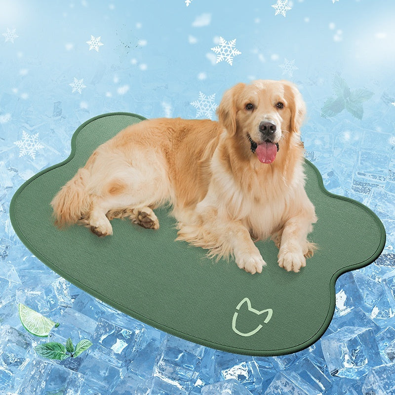 Dog lying on a green pet cooling pad with a blue icy background