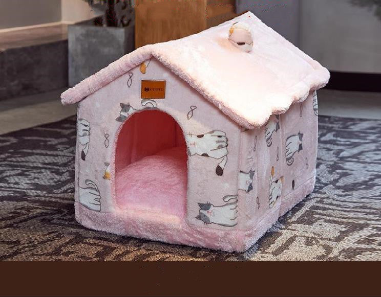 Pink pet house with cartoon designs on a patterned rug