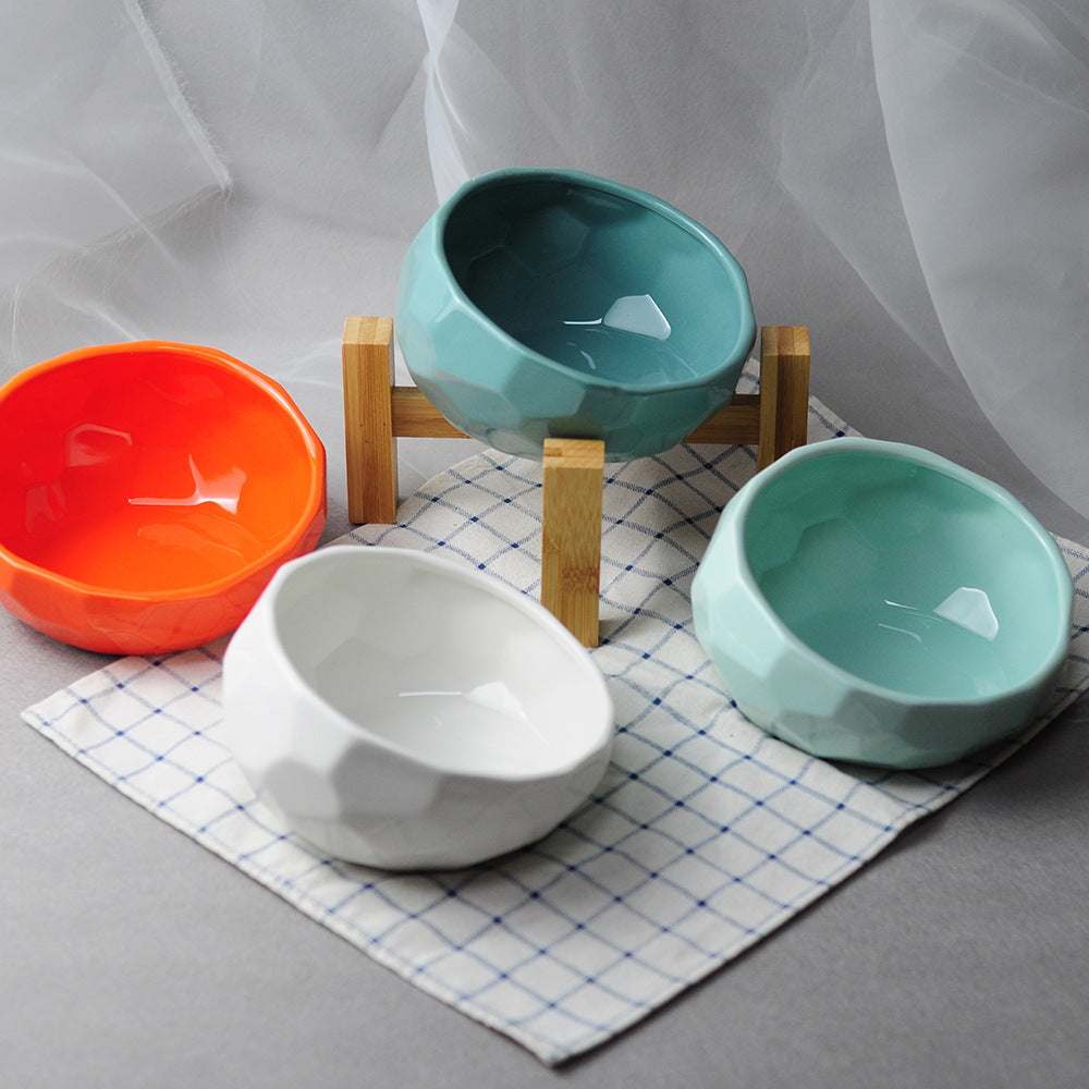 Ceramic oblique pet bowl for cats and dogs with elevated tilted feeding design