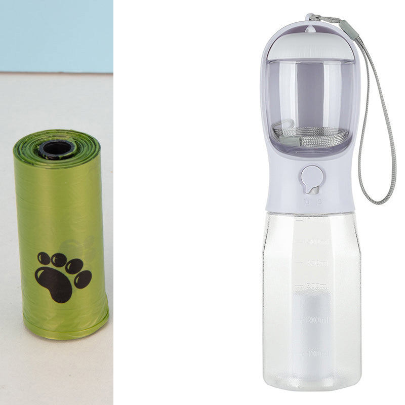 Clear pet water bottle with white cap and green pet waste bag dispenser on a white background