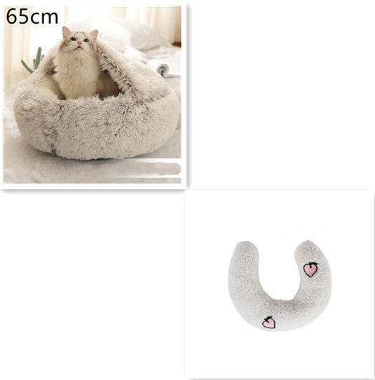 Fluffy pet bed with a cat inside and a heart-shaped pillow on a white background.