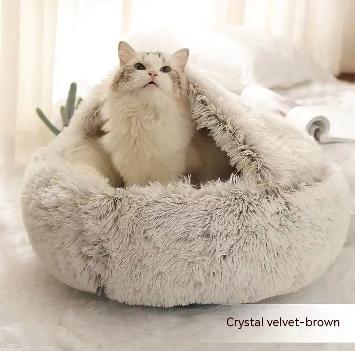Cat lying in a plush, crystal velvet-brown pet bed.