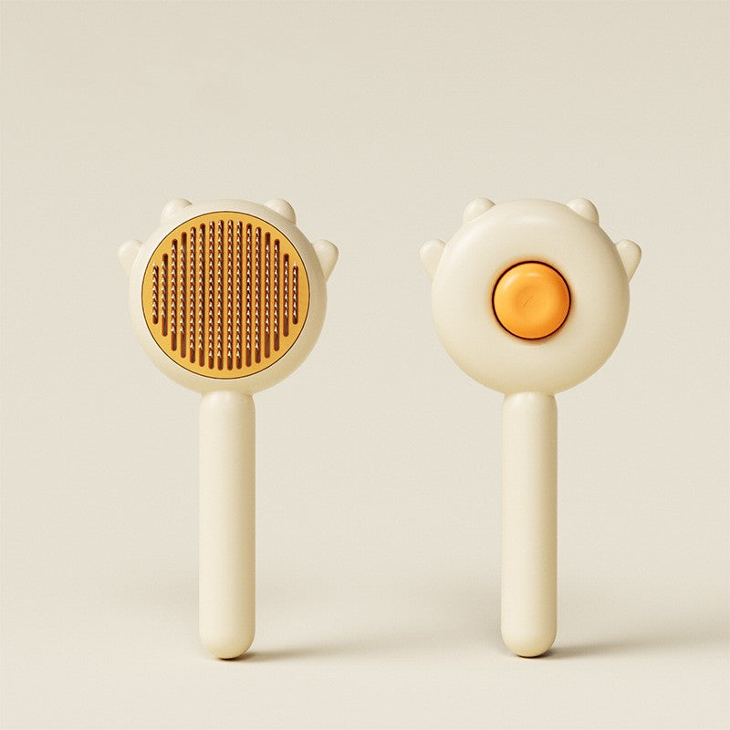 Two handheld tools with circular heads and white handles on a light beige background
