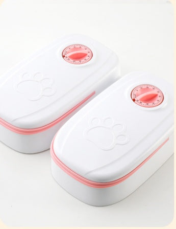 Two white containers with pink accents and red labels on a light gray background