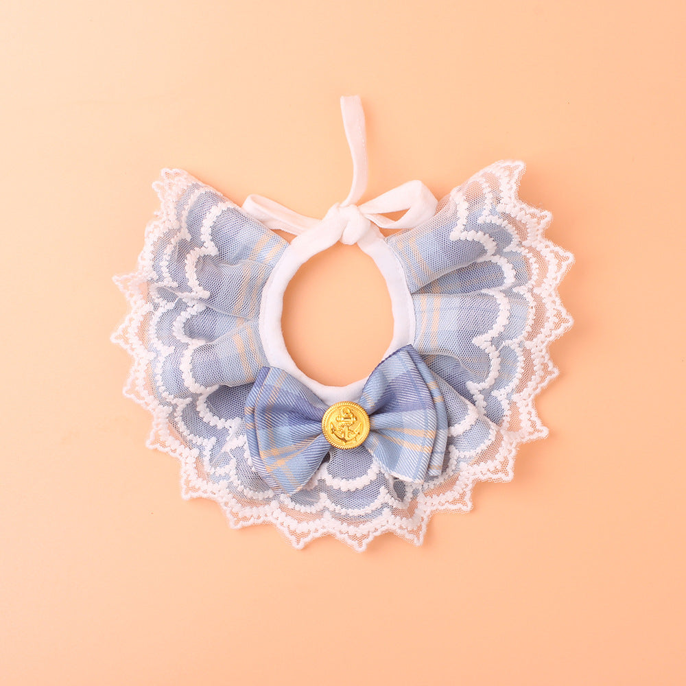 Close-up of bow detail on plaid lace cat bib collar showing fine craftsmanship