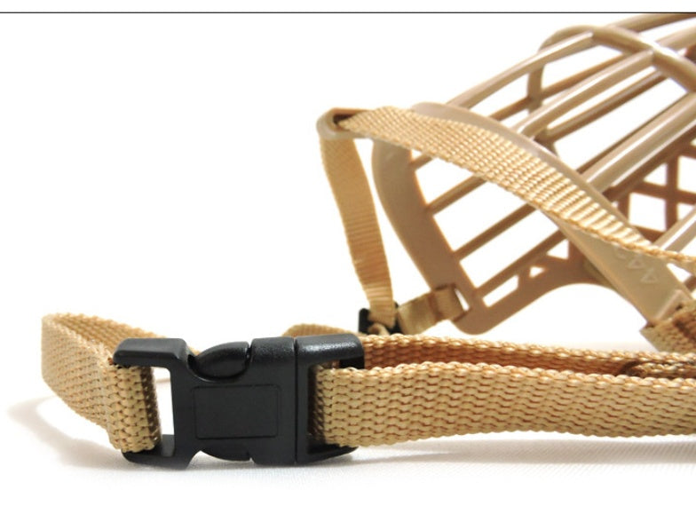 Tan dog muzzle with black buckle on a white background