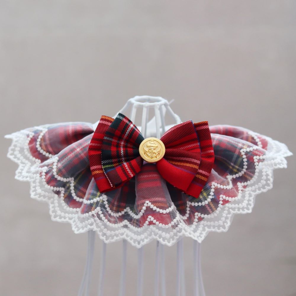 Side view of cute lace bib collar for cats with plaid pattern and bow accent