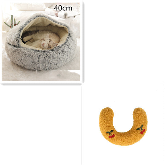 Fluffy pet bed with a cat inside and a yellow U-shaped toy on a white background.