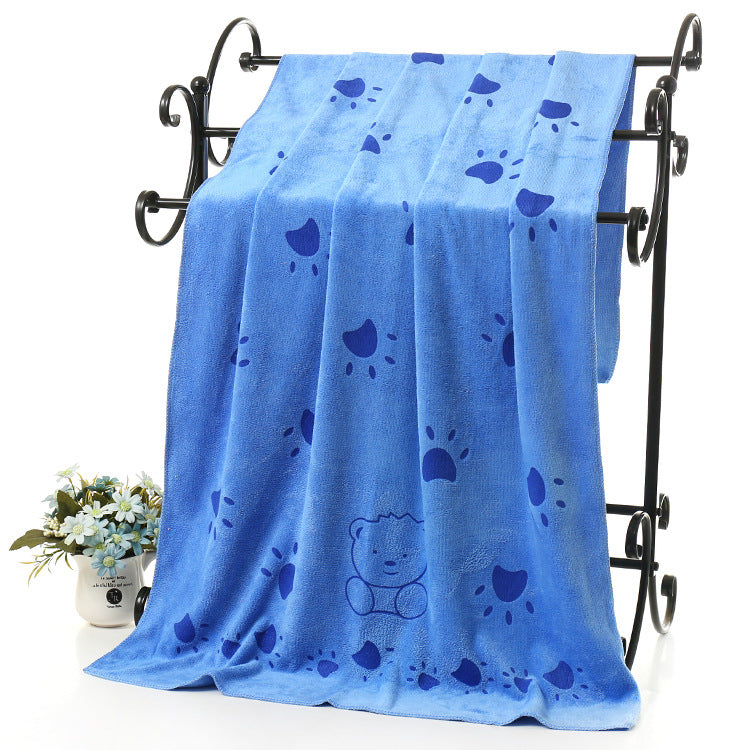 Cat wrapped in soft absorbent bath towel for gentle drying after grooming