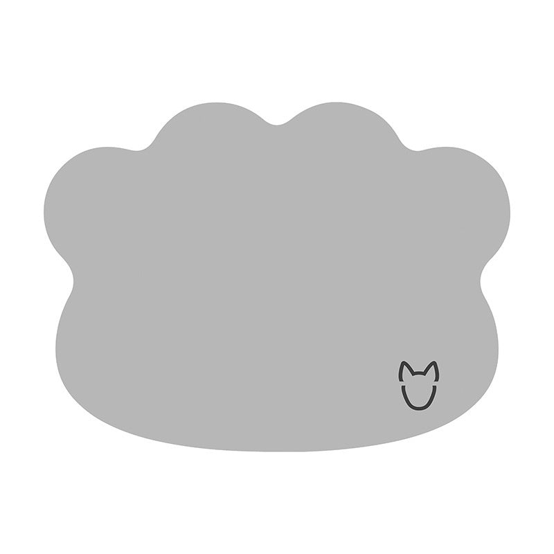 Beige cloud-shaped placemat with a small cat icon on a white background