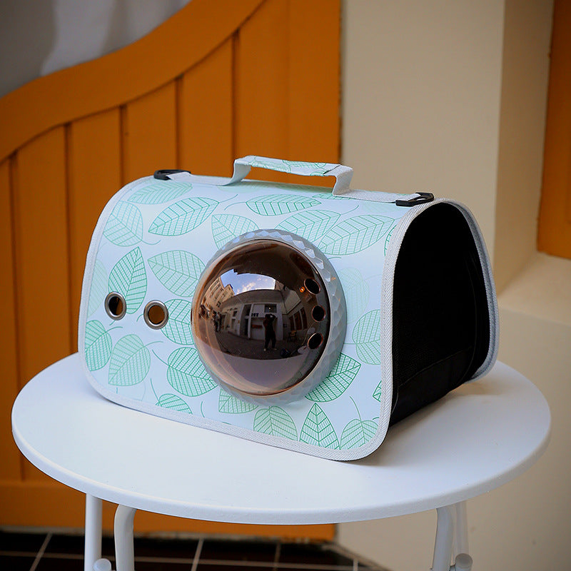 Pet carrier with leaf pattern on a white table