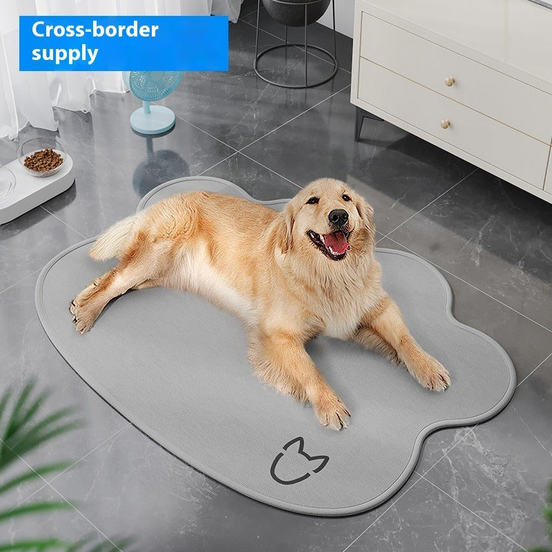 Dog lying on a gray pet mat in a room with furniture and decor.
