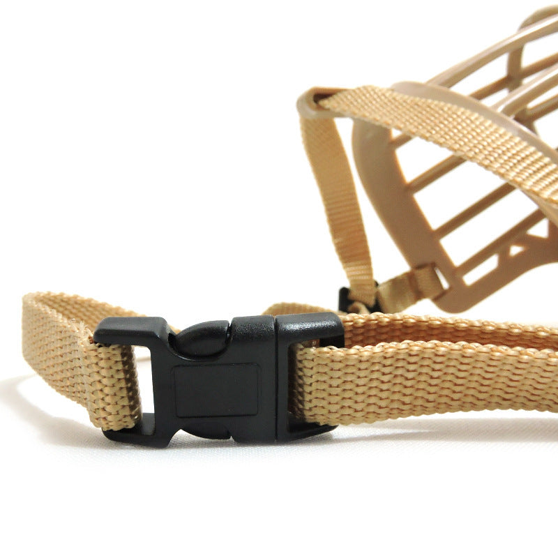 Close-up of a beige dog muzzle with a black plastic buckle on a white background