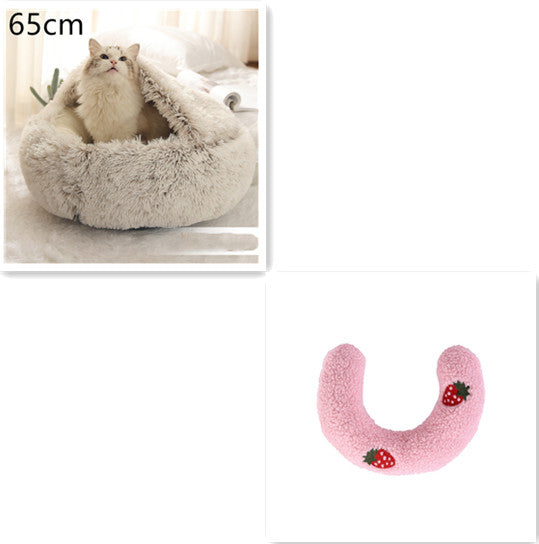 Fluffy pet bed with a cat inside and a pink U-shaped pillow with strawberry patterns on a white background.