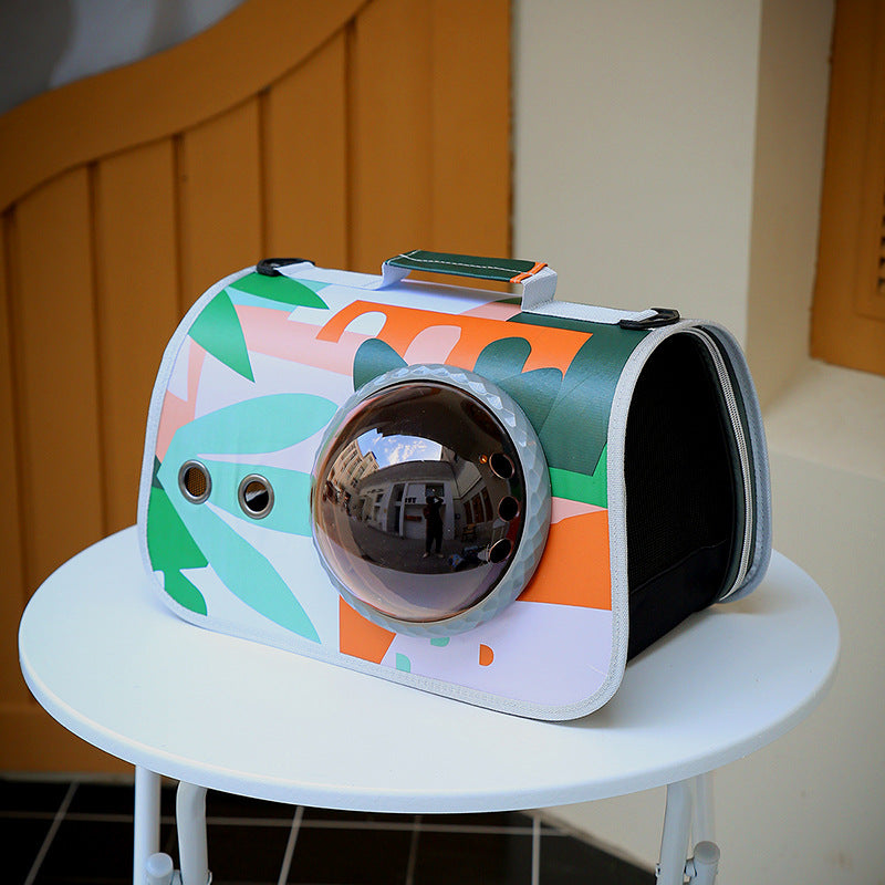 Colorful pet carrier with floral pattern on a white table