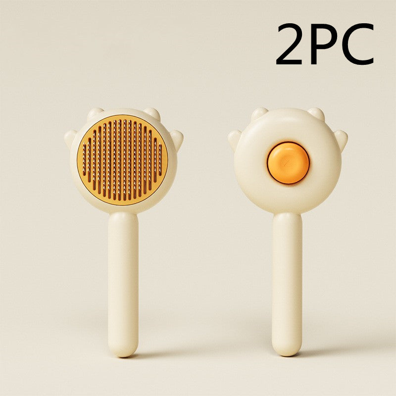 Two white handheld tools with orange centers on a light beige background, labeled '2PC'.