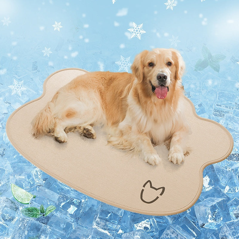 Dog lying on a heart-shaped pet cooling pad with a snowy background
